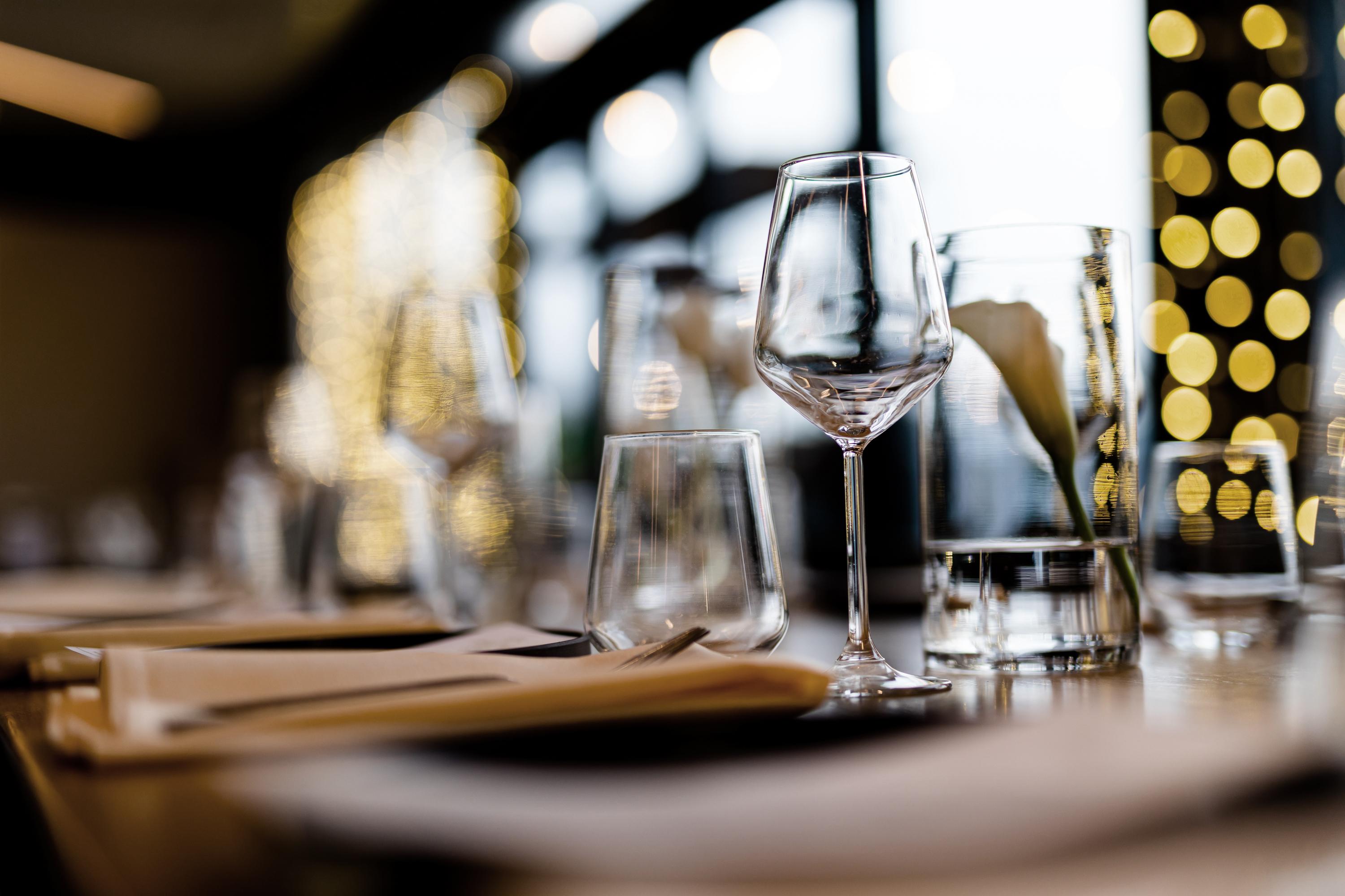 Close up shot of wine glasses at a restaurant